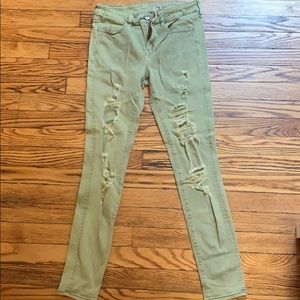 American Eagle green jeans with rips